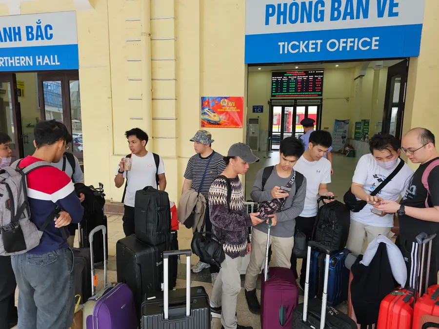 Advisory Apps team waiting at the station ticket office on the company trip to Vietnam