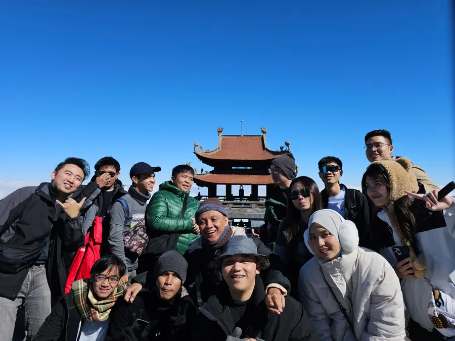 Advisory Apps team at the temple on the Fansipan summit in Vietnam