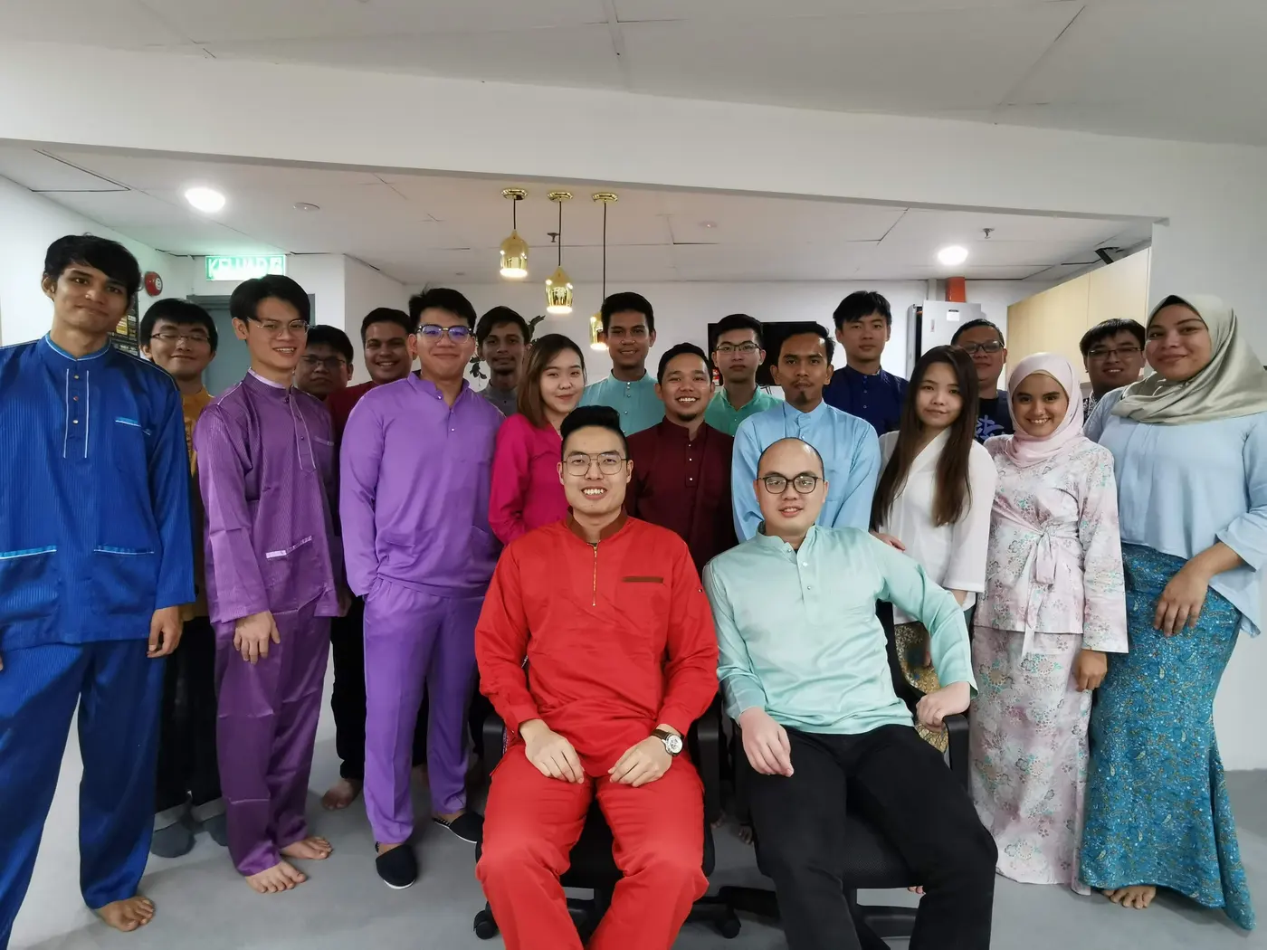 Advisory Apps team in traditional dress celebrating Hari Raya at the Kuala Lumpur office